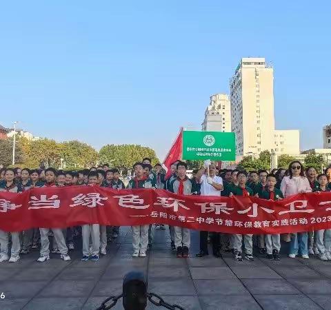 二中学生志愿者捡白色垃圾，保护好一江碧水
