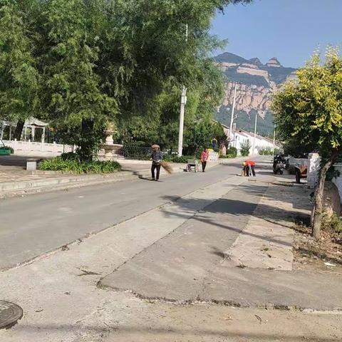 环境勤整治  家园换新颜