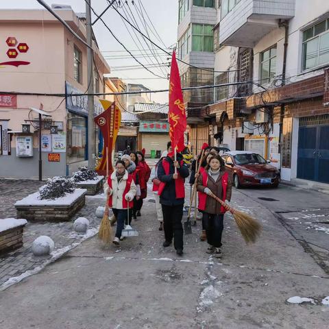 建设路社区开展“党旗飘扬在一线 铲雪除冰在行动”活动