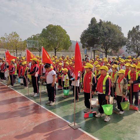 学雷锋见行动   清洁家园齐动手      ——金山镇中心小学雷锋日实践活动