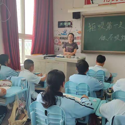 【高新教育】西安高新区第十二初级中学 “拒吸第一支烟 做不吸烟新一代”签名活动主题班会