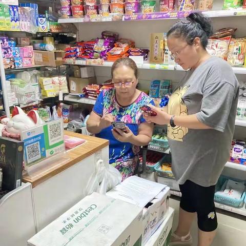 圪塔寺社区开展“全民医保手牵手，医保护航心连心”居民医保宣传缴费工作