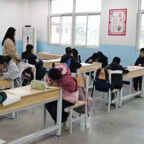 春风三月花草香 正值学子读书时 ——王庄镇新寨中心小学举行月考测评活动