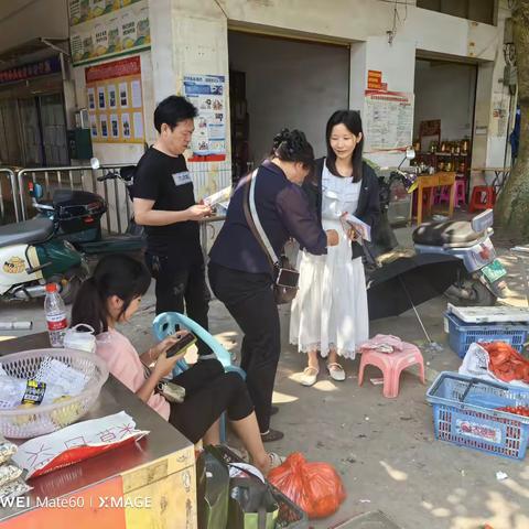 新市村委会开展反邪教宣传活动