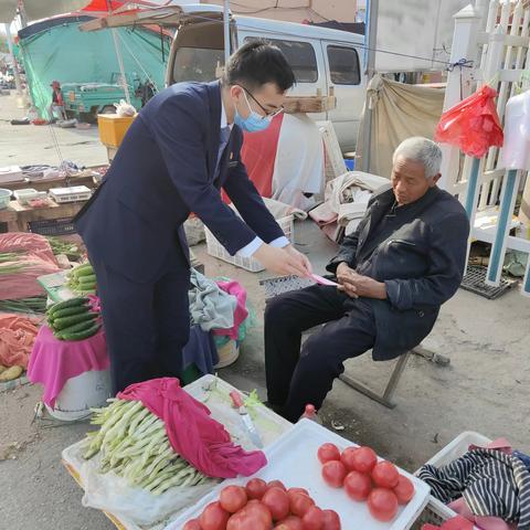 青岛农商平度南村支行春风送暖入网格宣传教育活动