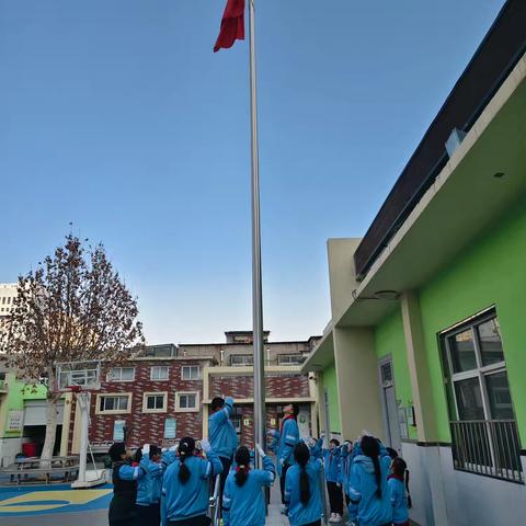 庆澳门回归，盼祖国统一——外国语小学举行澳门回归主题升旗仪式