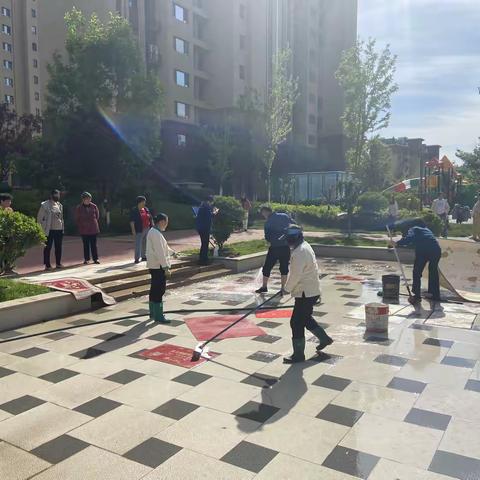 "小地垫"洗出"大民生"——锦川社区“红色物业”开展便民洗地垫活动