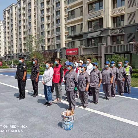 开展消防防汛综合演练，筑牢小区业主安全防线