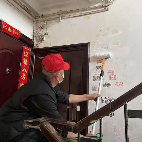 延静寺社区退伍军人参加“清理小广告 助力创城”活动
