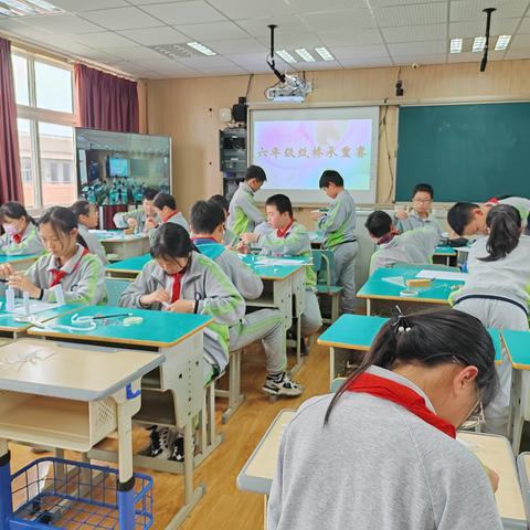 菱湖实验小学举行科技节六年级纸结构桥梁承重赛