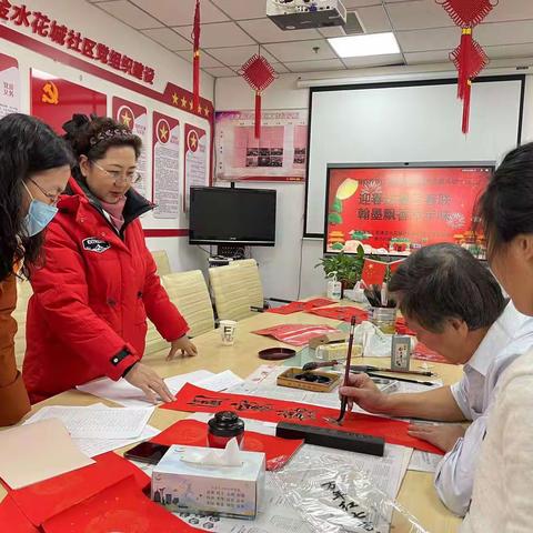 迎春送福写春联 翰墨飘香添年味 ——五三街道金水花城社区开展写春联送祝福活动