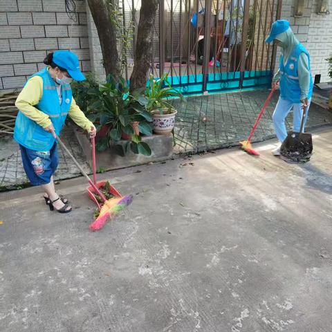 临高县第一小学教师参与江北小区双创卫生活动