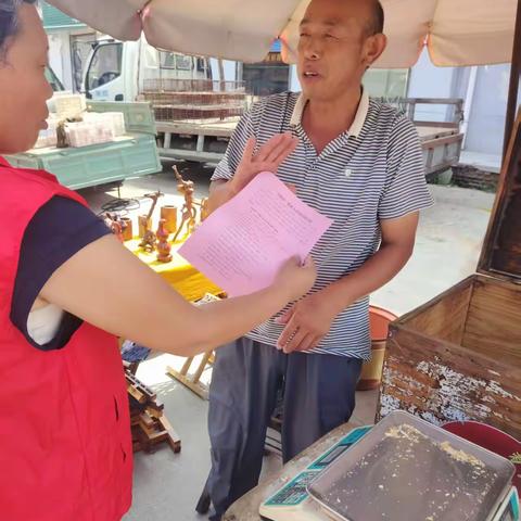 网格员大集“反邪”宣传行：筑牢群众思想防线