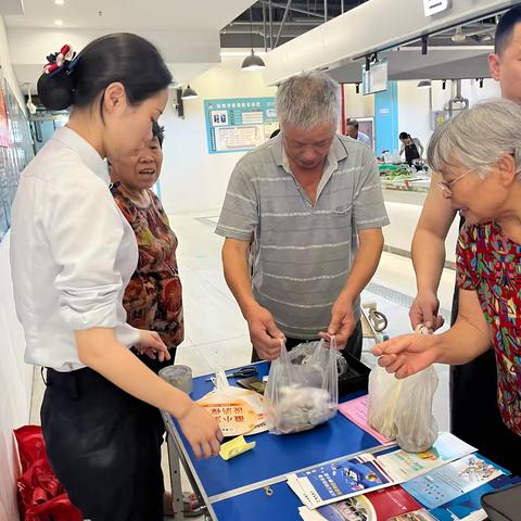 慈溪支行于烟火里菜市场举办硬币大篷车活动