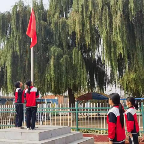 扒齿港镇大沙窝完全小学少先队建队日暨入队仪式