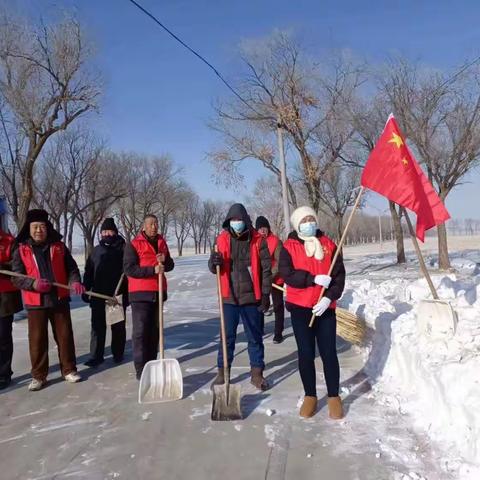 白雪飘飘党旗红   扫雪除冰暖人心