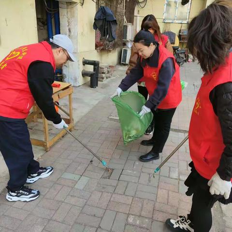 "弘扬雷锋精神 共建文明城市"——民进市实验小学支部开展志愿者服务活动