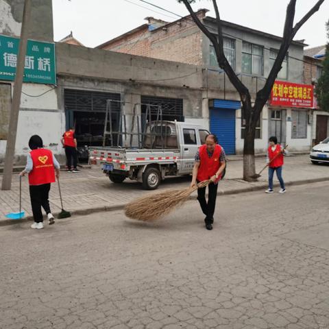 区直工委开展卫生城市迎复审“党员志愿服务”活动